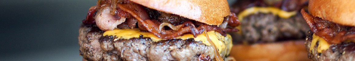 Eating Burger at Burger Hut restaurant in Bakersfield, CA.
